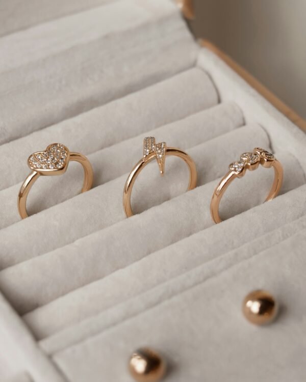 Sparkling Charms: Rose Gold-Tone Icon Rings Collection